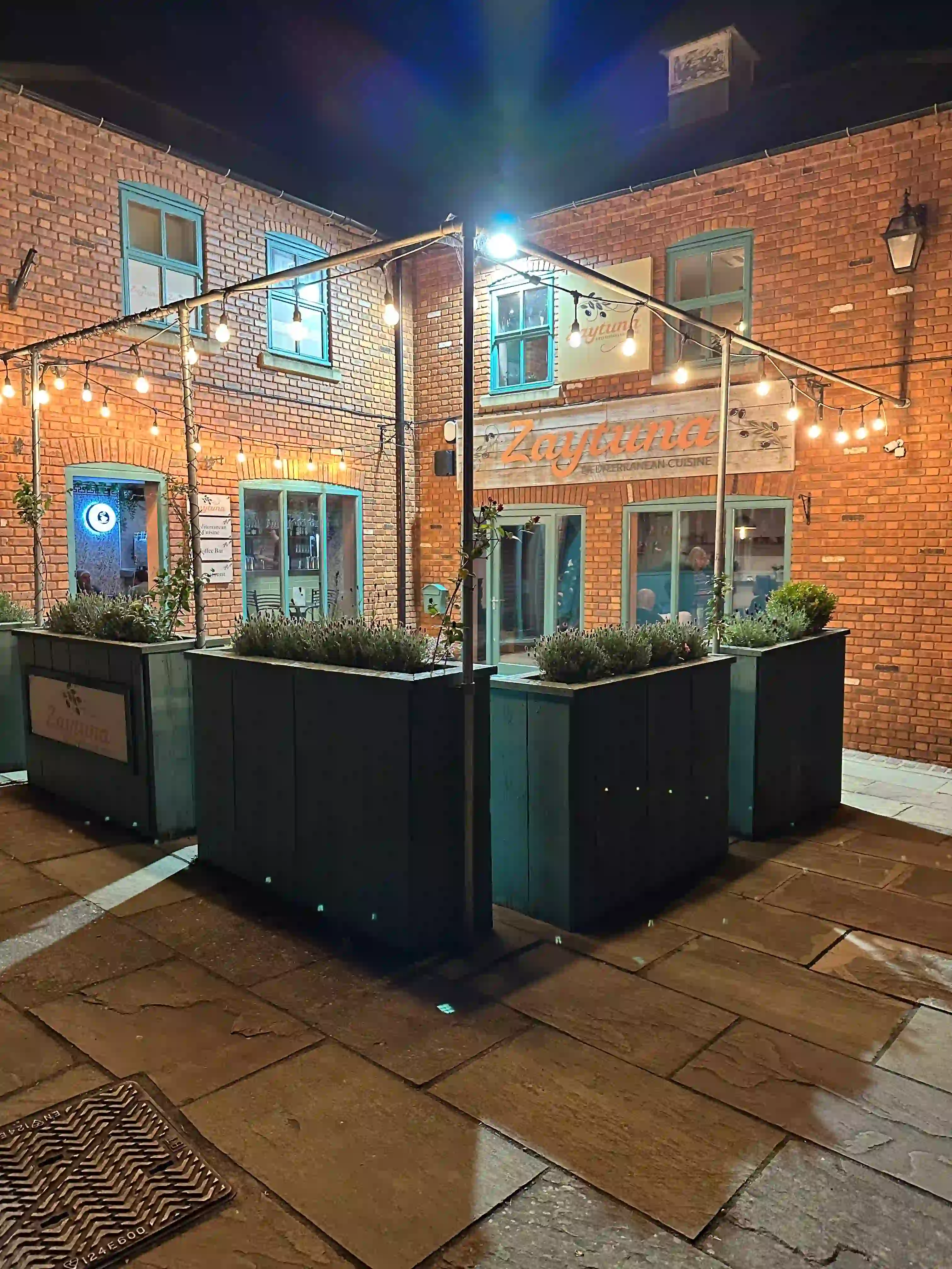 Our restaurant's facade at night, looking from an angle